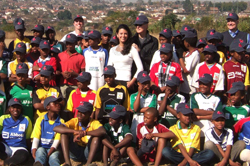 Boston Red Sox owner and MGH Trustee John Henry and his wife Linda visiting the WhizzKids Program in South Africa in 2009 